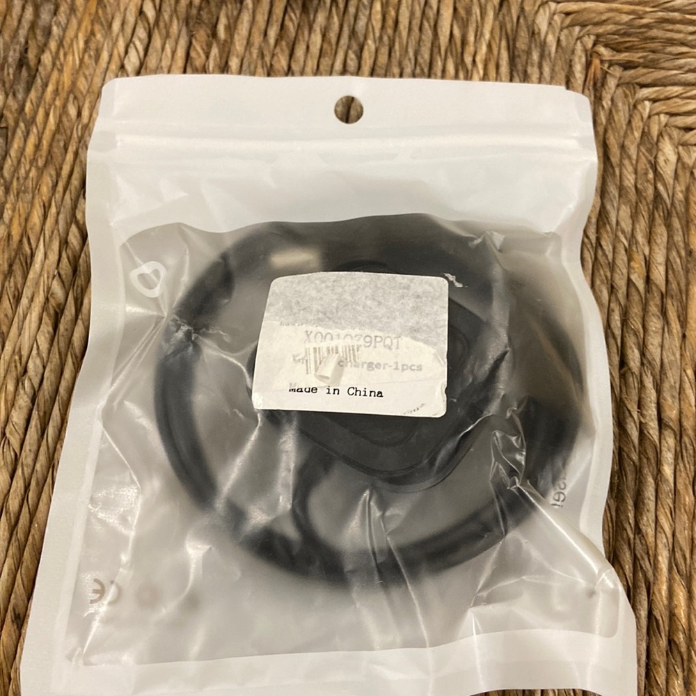 Never open Fitbit versa charging cable